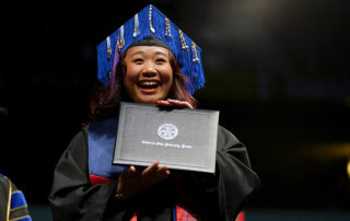 Student holding diploma